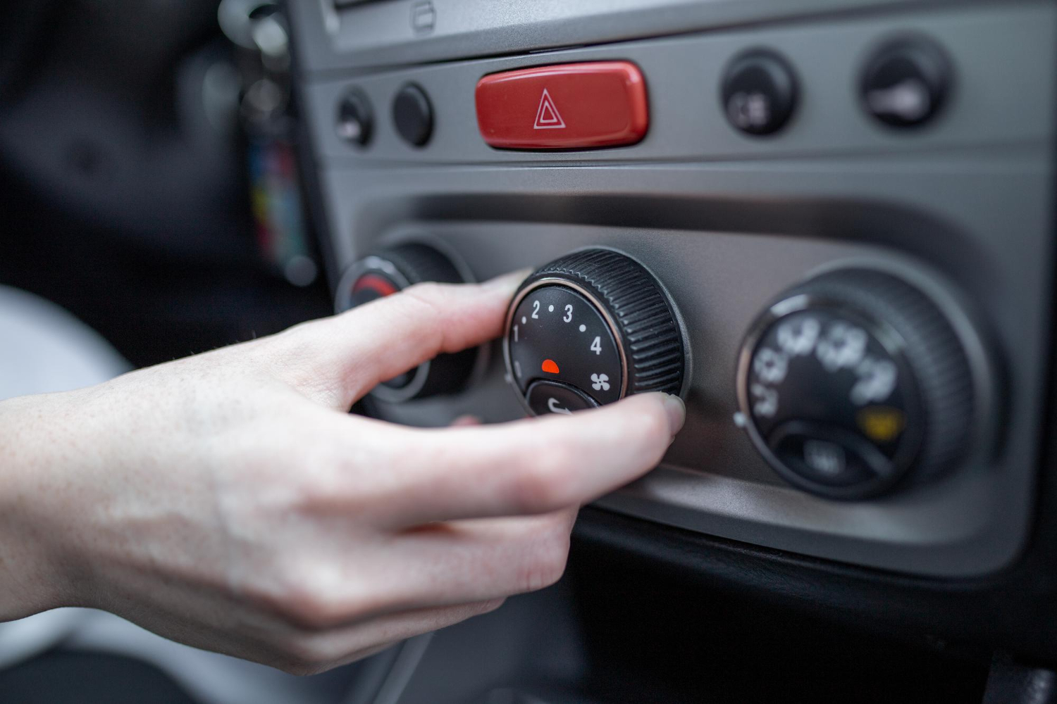 woman-hand-turning-car-air-conditioning-system-car-air-conditioner-off-button-close-up-view (1)